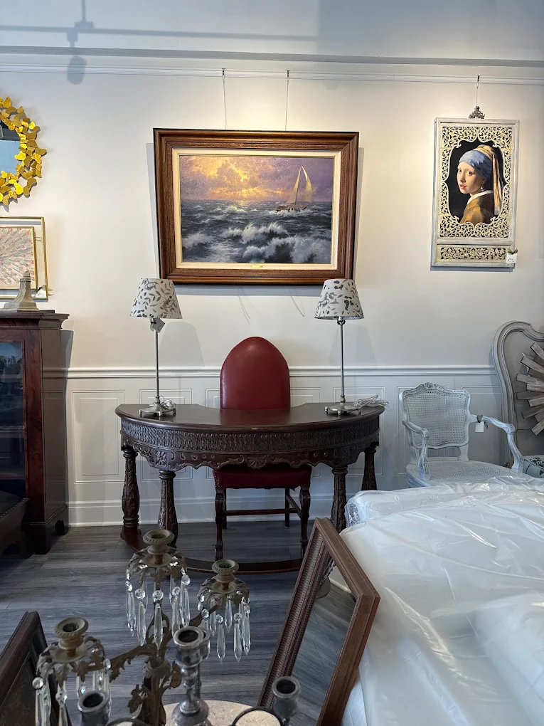 Framed seascape and vintage side table vignette