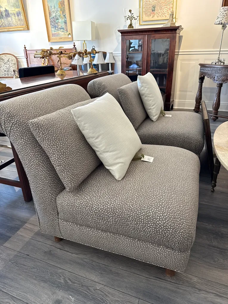 Upholstered accent chairs with throw pillows