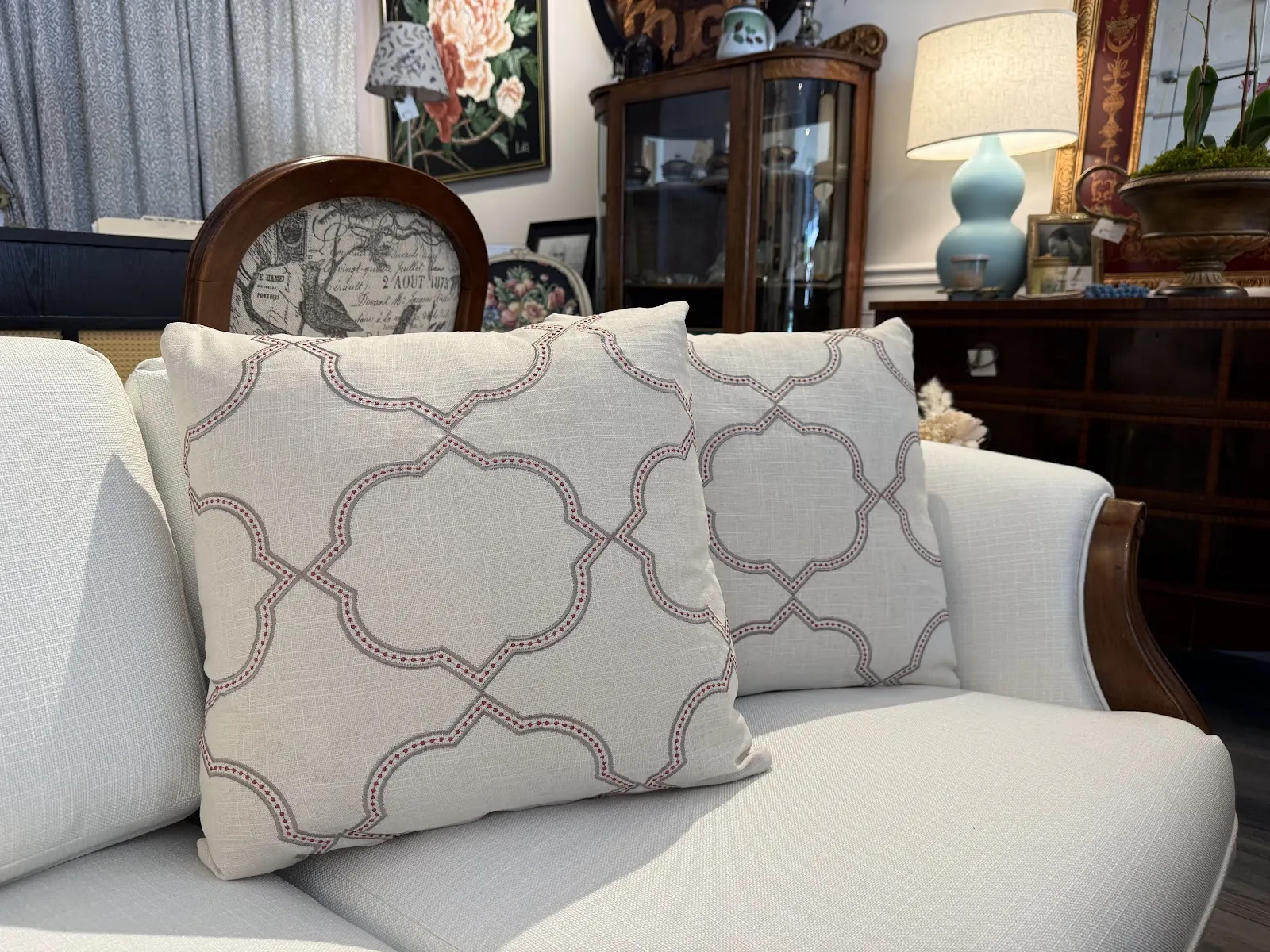 Cream sofa with quatrefoil-pattern throw pillows