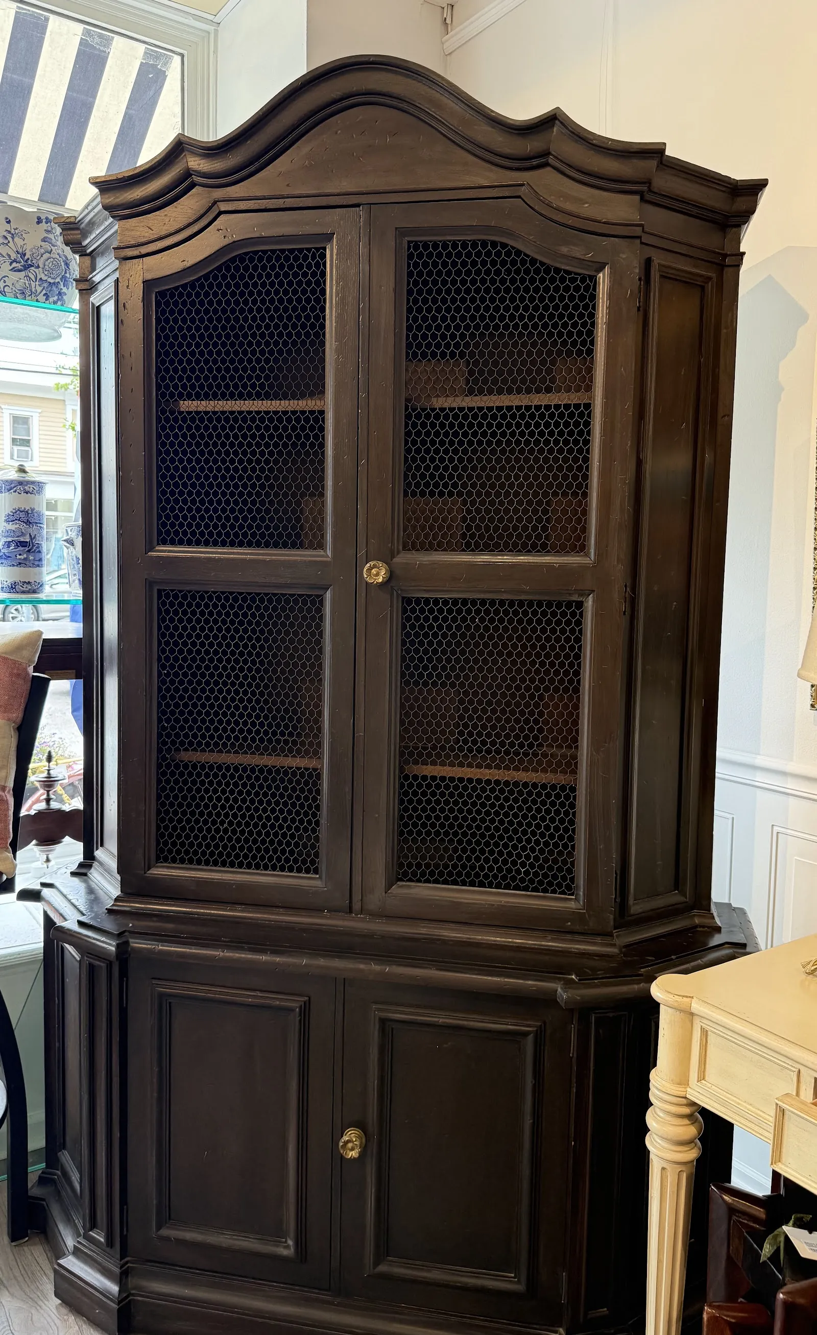 Dark wood china cabinet with glass doors